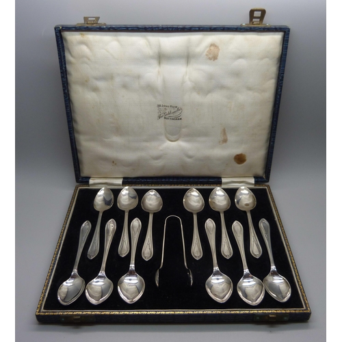 838 - A cased set of twelve silver spoons with sugar bows, 161g