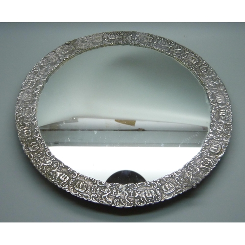 839 - An Eastern white metal mirrored tray, tests as silver, one foot missing, 27cm