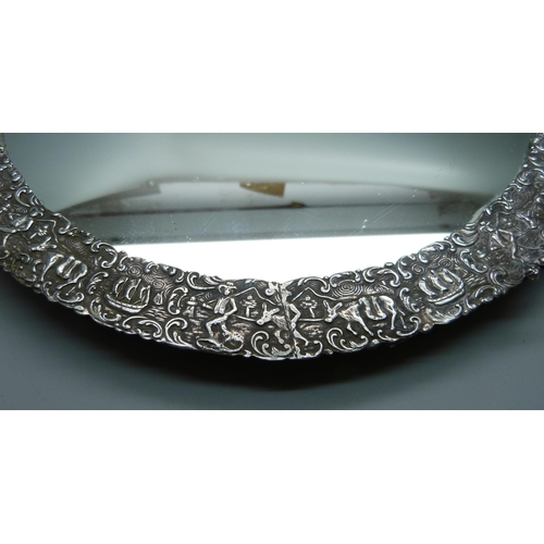 839 - An Eastern white metal mirrored tray, tests as silver, one foot missing, 27cm