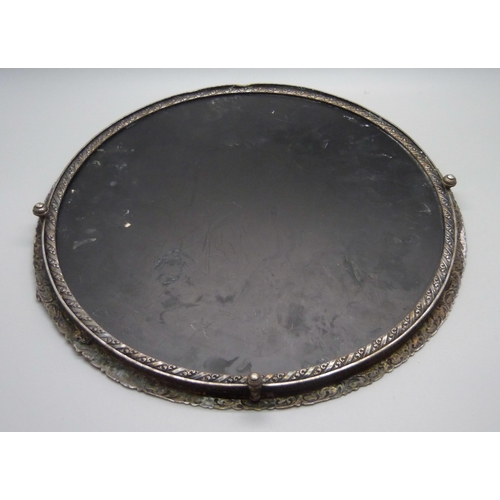 839 - An Eastern white metal mirrored tray, tests as silver, one foot missing, 27cm