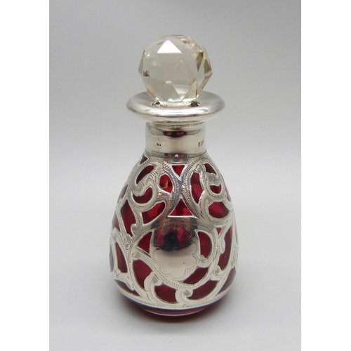 854 - A cranberry glass bottle with 925 silver overlay, 80mm