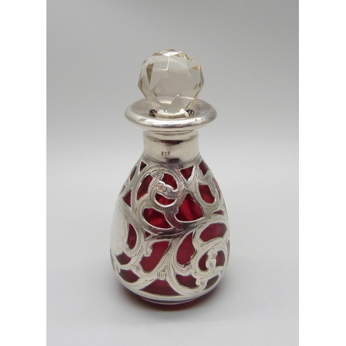 854 - A cranberry glass bottle with 925 silver overlay, 80mm