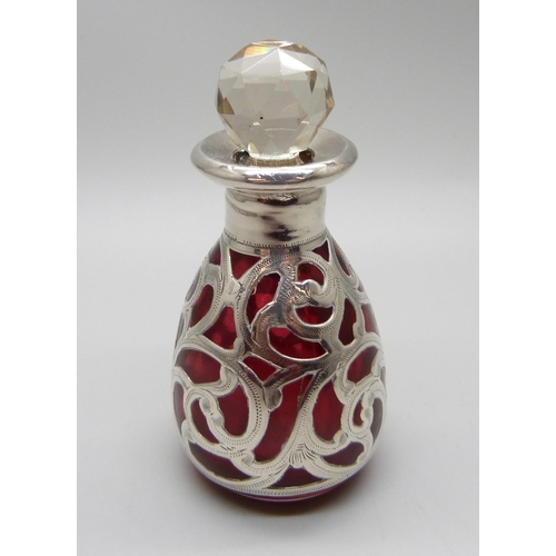 854 - A cranberry glass bottle with 925 silver overlay, 80mm