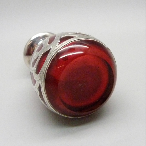 854 - A cranberry glass bottle with 925 silver overlay, 80mm