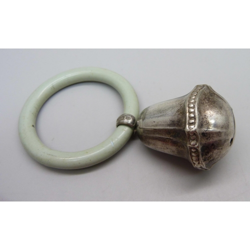 855 - A Victorian silver rattle, Birmingham 1865 and one other rattle marked Alpacca