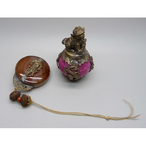 876 - A Chinese agate set pendant and a dog of foe mounted on a ball