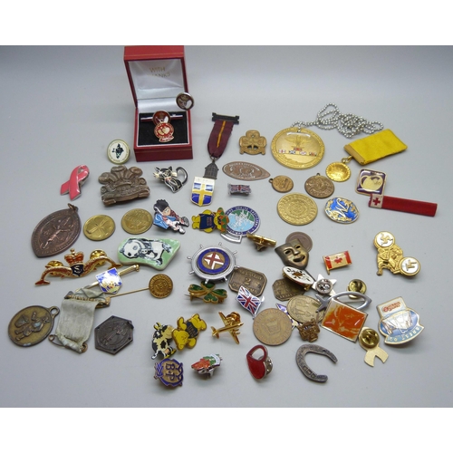 882 - A collection of badges, medallions, etc., including three silver blood donor pins