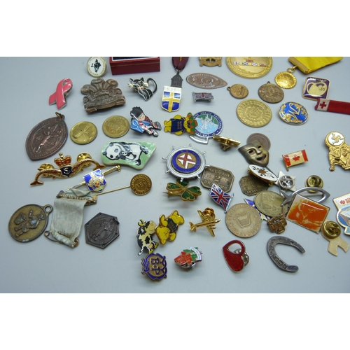 882 - A collection of badges, medallions, etc., including three silver blood donor pins