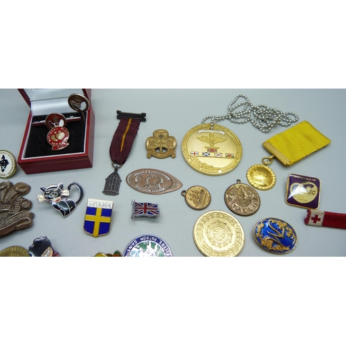 882 - A collection of badges, medallions, etc., including three silver blood donor pins