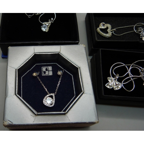 895 - Three Swarovski crystal pendants and chains and one other