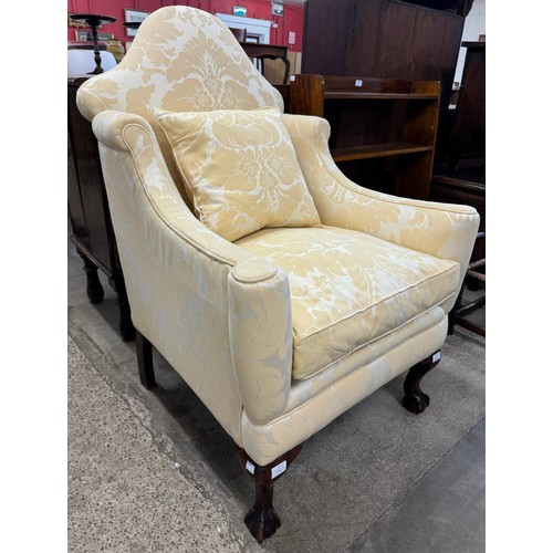 323 - A Queen Anne style mahogany and fabric upholstered armchair