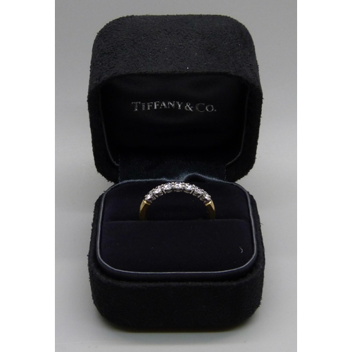 926 - A Tiffany & Co. 18ct gold, platinum set and seven stone diamond ring, 3.9g, P/Q, boxed