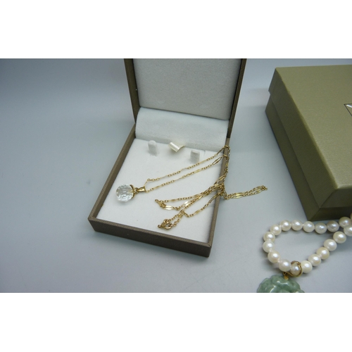 929 - A 9ct gold and crystal pendant and chain, (chain 2.1g) and a pearl necklace with jade pendant and 14... 