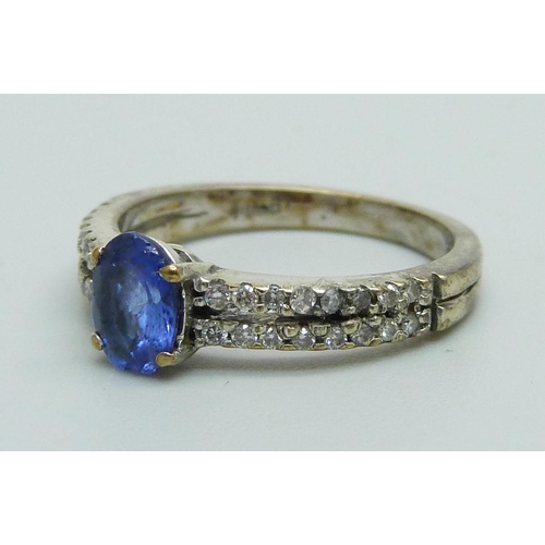 931 - A 9ct white gold thirty-two stone diamond and single stone tanzanite ring, 3g, M