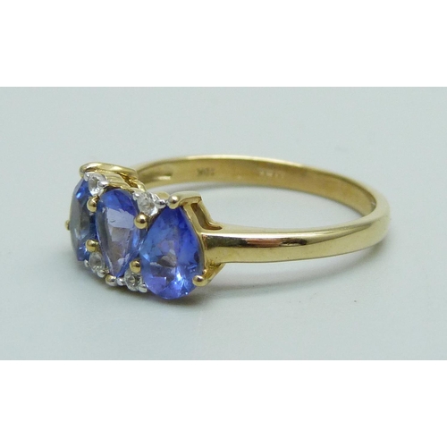 932 - A 9ct gold, tanzanite and white stone ring, 2.1g, N