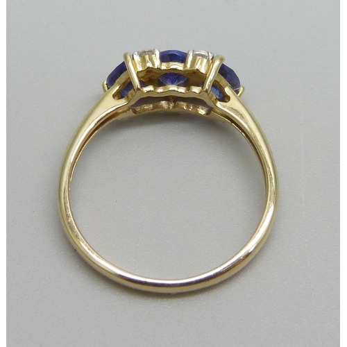 932 - A 9ct gold, tanzanite and white stone ring, 2.1g, N