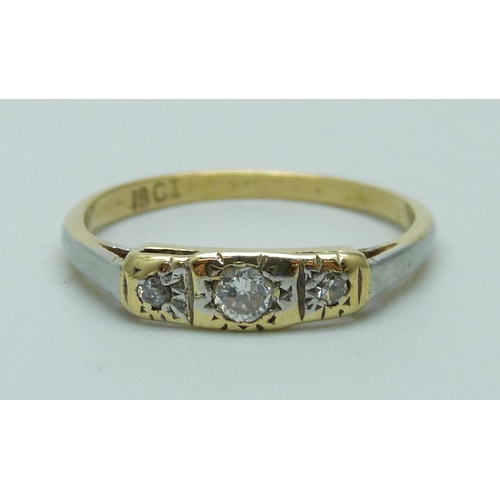 935 - An 18ct gold three stone diamond ring, 2.1g, L