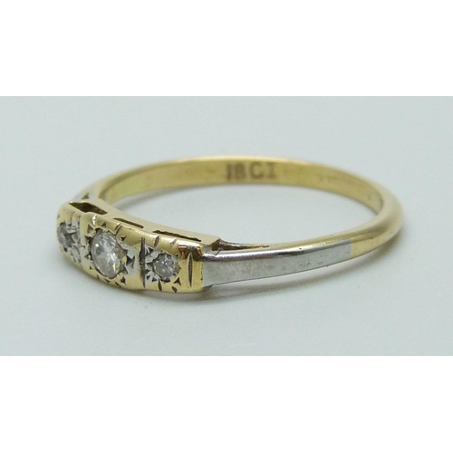 935 - An 18ct gold three stone diamond ring, 2.1g, L