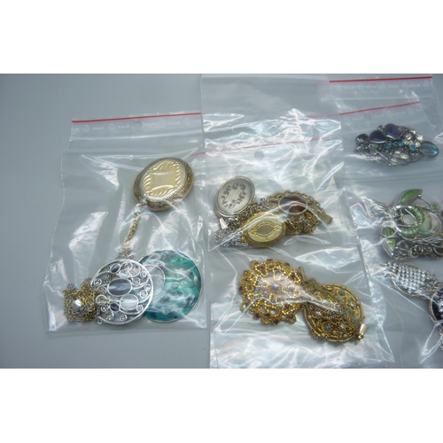 939 - Twenty-two costume pendants and chains