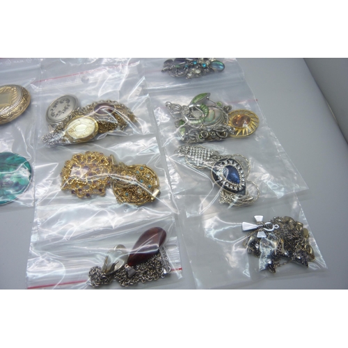 939 - Twenty-two costume pendants and chains