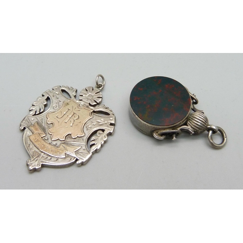 945 - A Victorian silver compass fob set with bloodstone, Birmingham mark by Durban & Co., and a Victorian... 