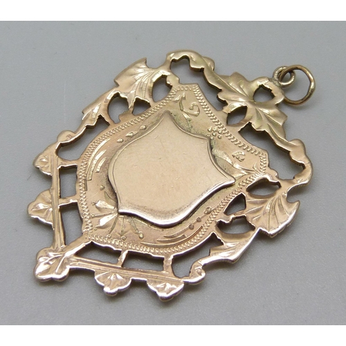 947 - A late Victorian 9ct gold fob medal, Birmingham 1898, 8.9g, 28mm wide