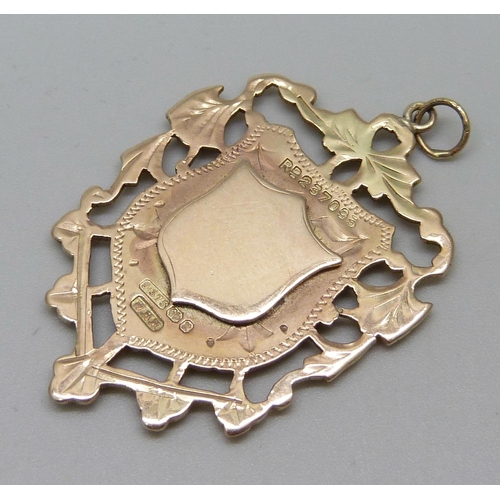 947 - A late Victorian 9ct gold fob medal, Birmingham 1898, 8.9g, 28mm wide