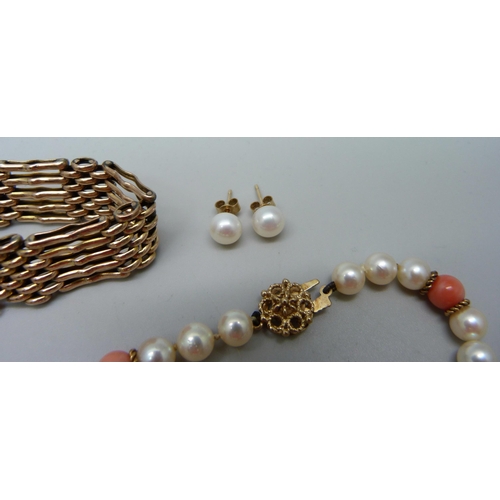 948 - A 9ct gold gate bracelet, 20.2g, a pearl and coral bracelet with 9ct gold clasp, a pearl necklace an... 