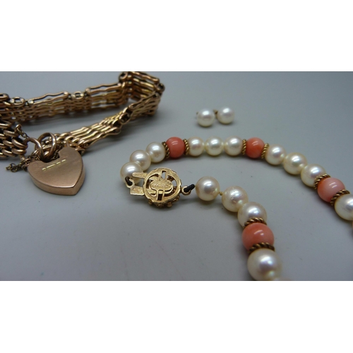 948 - A 9ct gold gate bracelet, 20.2g, a pearl and coral bracelet with 9ct gold clasp, a pearl necklace an... 