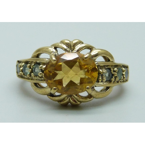 952 - A 9ct gold, citrine and green/blue stone ring, 3.6g, K