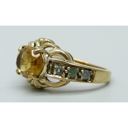 952 - A 9ct gold, citrine and green/blue stone ring, 3.6g, K