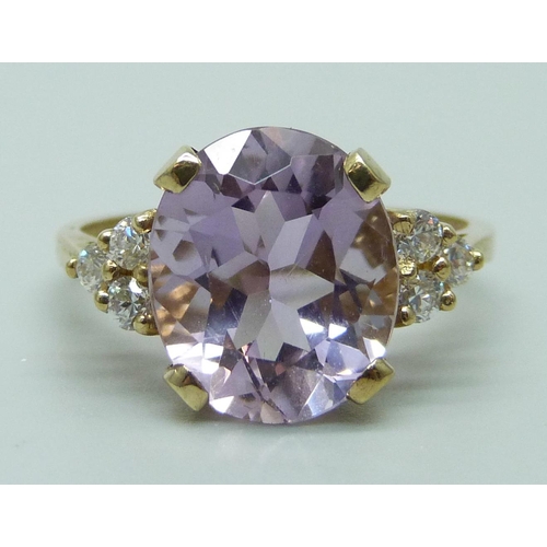 953 - A 9ct gold, amethyst and CZ ring, 3.1g, O