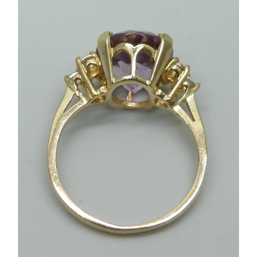 953 - A 9ct gold, amethyst and CZ ring, 3.1g, O