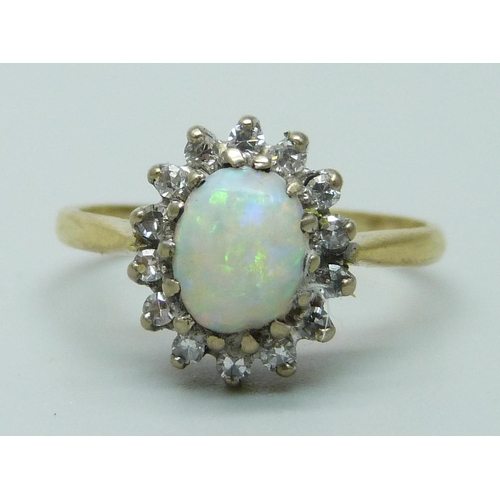 955 - An 18ct gold opal and diamond cluster ring, 3.4g, M