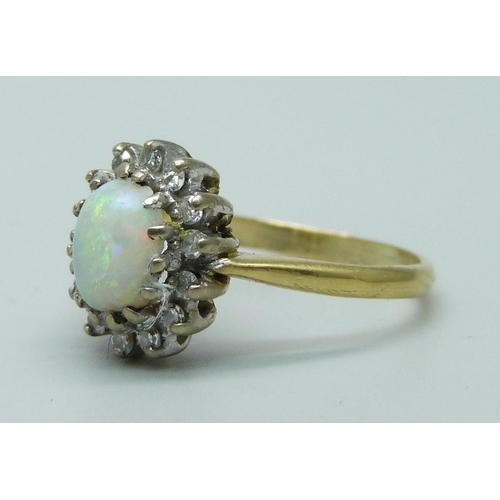 955 - An 18ct gold opal and diamond cluster ring, 3.4g, M