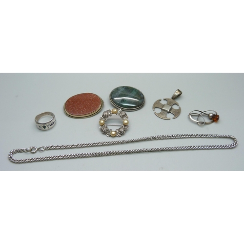 956 - A silver ring, a silver pendant, two stone set brooches, two silver brooches and a chain, (green sto... 