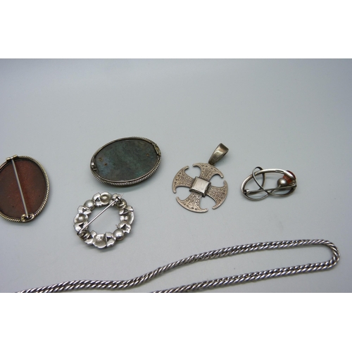 956 - A silver ring, a silver pendant, two stone set brooches, two silver brooches and a chain, (green sto... 