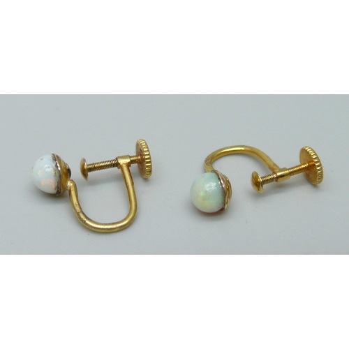 968 - A pair of 15ct gold and opal earrings, screw backs, 1.6g