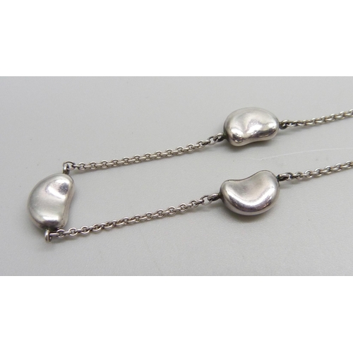 971 - A silver Tiffany & Co. necklace and a pair of earrings, signed Elsa Peretti, necklace 41cm