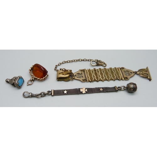 976 - An 800 silver fob/tassel, mesh a/f, a similar plated one and two other fobs