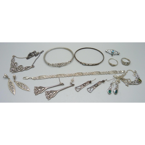 977 - A collection of silver jewellery including bangles, earrings, necklaces, etc.