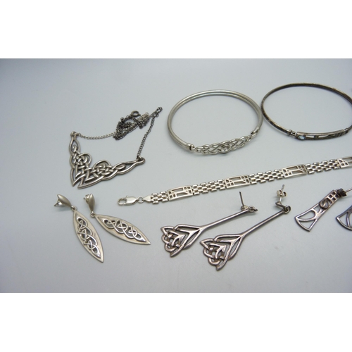 977 - A collection of silver jewellery including bangles, earrings, necklaces, etc.