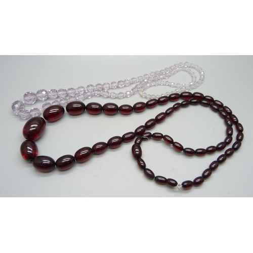 984 - A string of sherry amber coloured beads and a faceted bead necklace