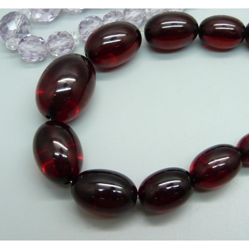 984 - A string of sherry amber coloured beads and a faceted bead necklace