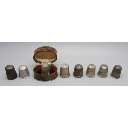 991 - A collection of eight silver thimbles including one Charles Horner, one in a fitted thimble box, two... 