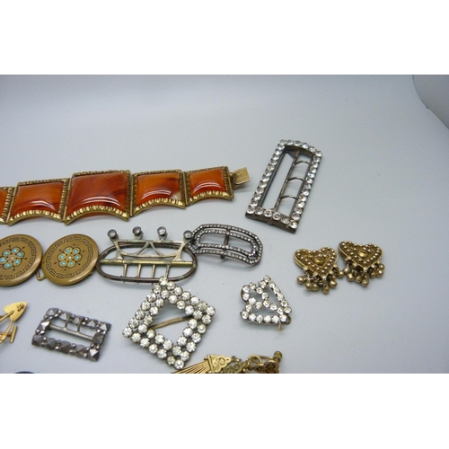 998 - A collection of vintage jewellery and buckles, including a gold mining brooch, one panel of large br... 