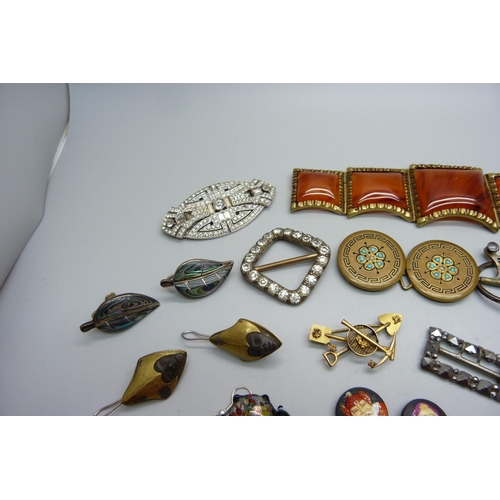 998 - A collection of vintage jewellery and buckles, including a gold mining brooch, one panel of large br... 