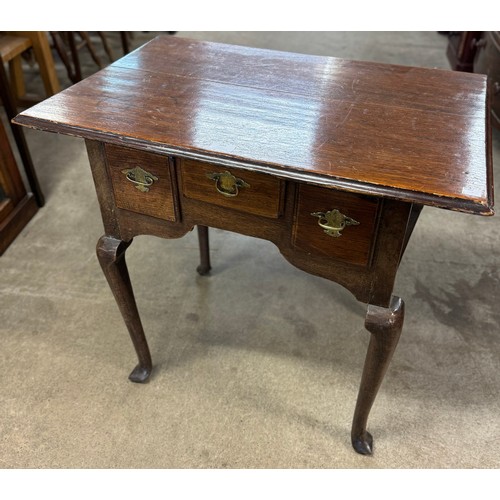 304 - A George III oak lowboy