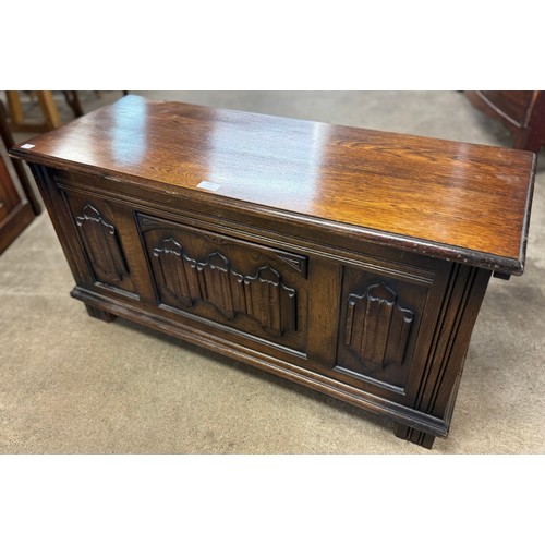 310 - A 17th Century style carved oak blanket box