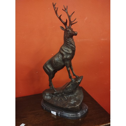 130 - A large French style bronze figure of a stag, on black marble socle